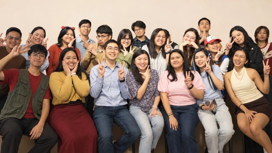 The 7th Media team, 23 people, smiling together